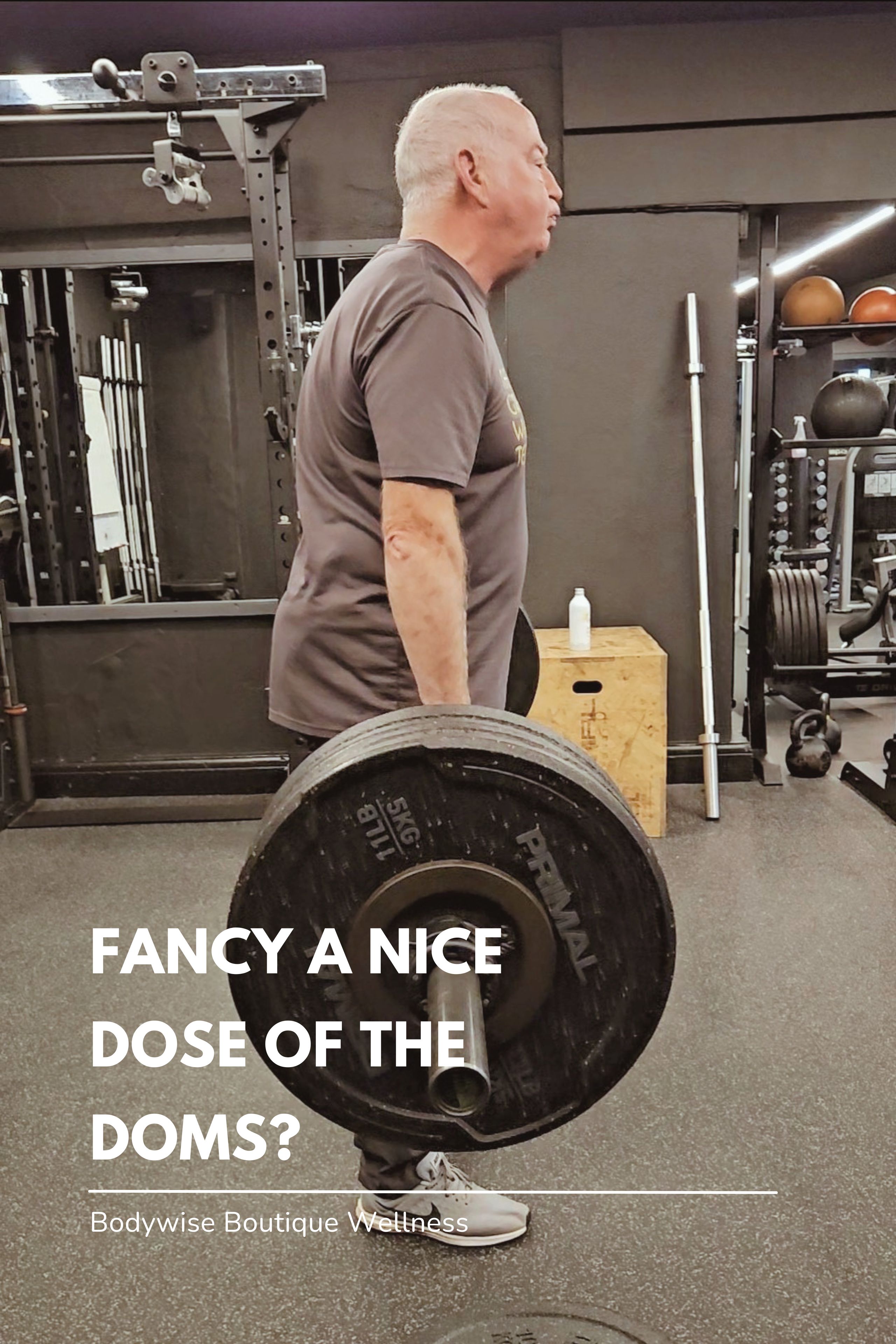 70 year old man deadlifts in the gym